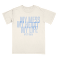 Front view of an ivory unisex short-sleeve T-shirt with blue text across the front reading ‘My Mess, My Heart, My Life,’ and smaller text below reading ‘Myles Smith.